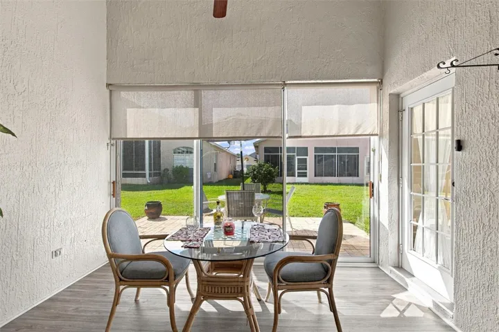 Florida room opens to a brick paver open-air patio