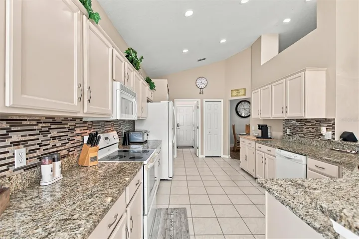 Granite countertops, tile backsplash and recessed  LED lights