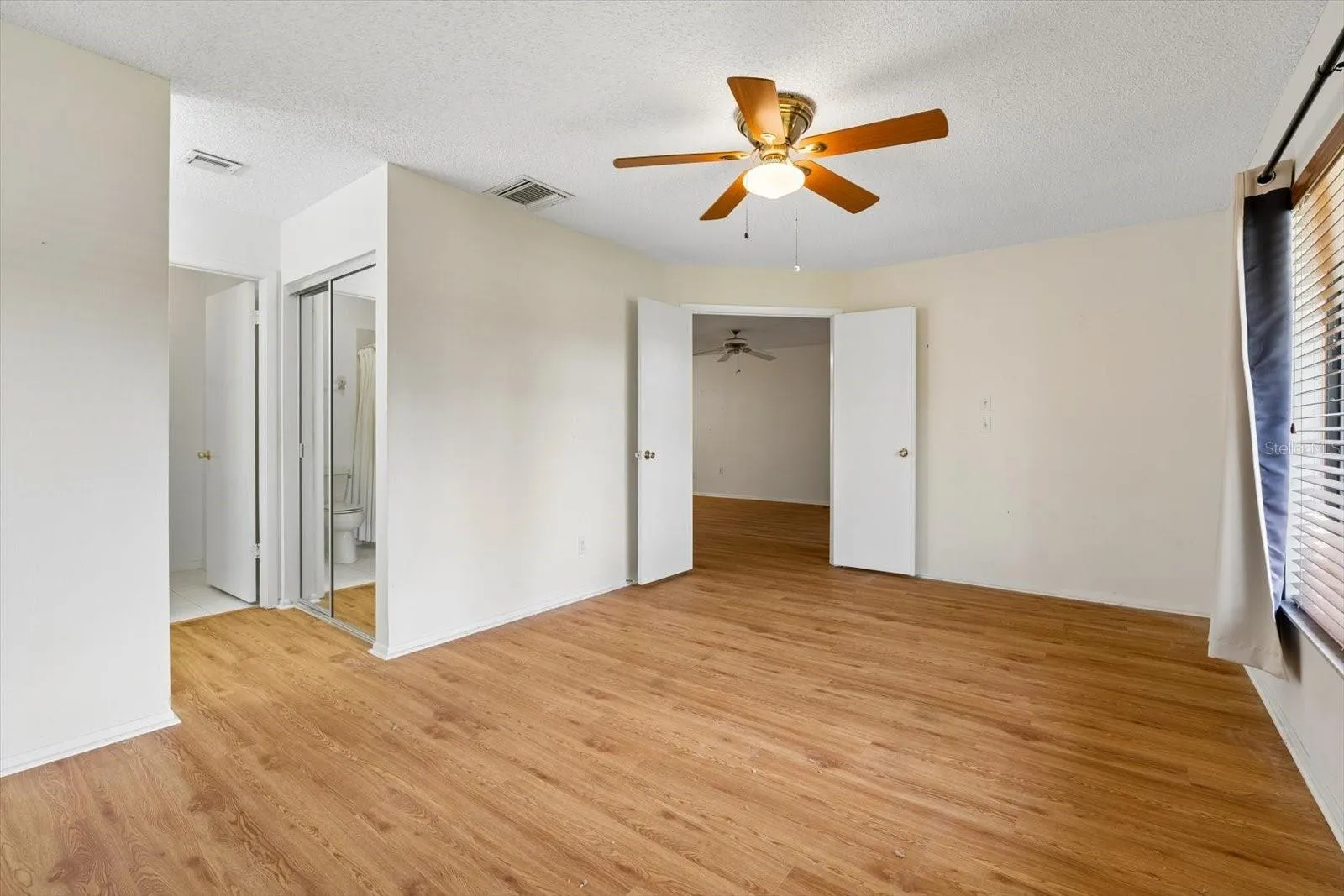 Primary Bedroom with Walk-in Closet and En-suite Bath