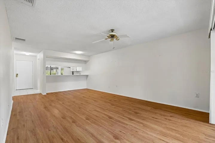 Living Room to Kitchen and Front Door