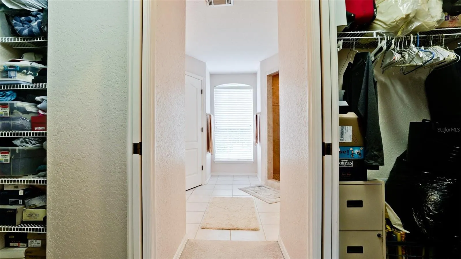Spacious primary closets upon entering ensuite
