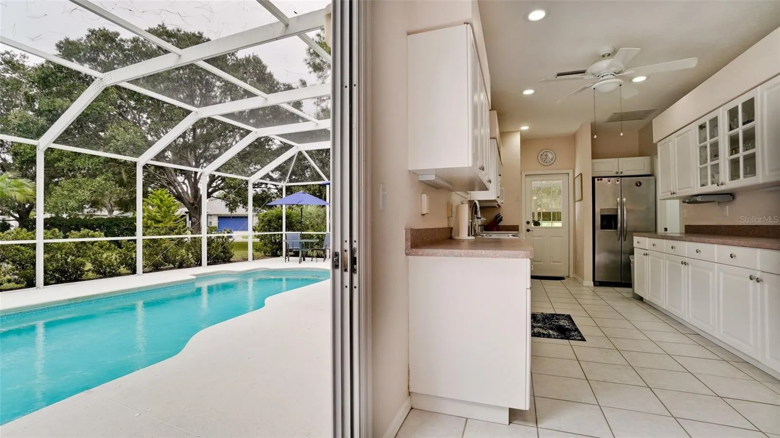 step right out of the kitchen to the pool deck