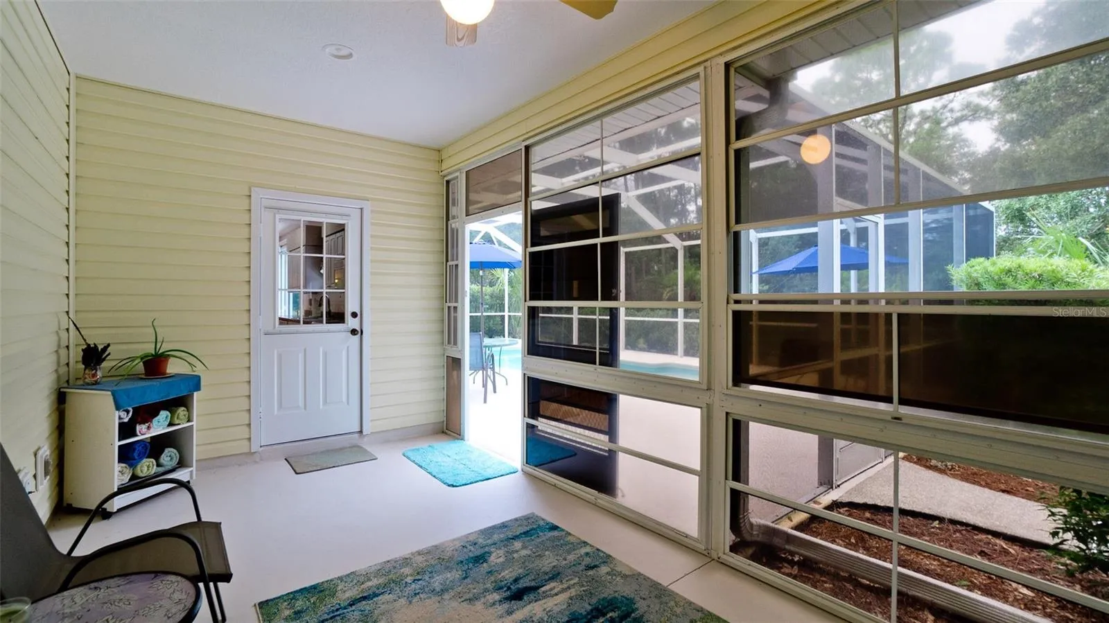All seasons room just off the kitchen w/access to the pool