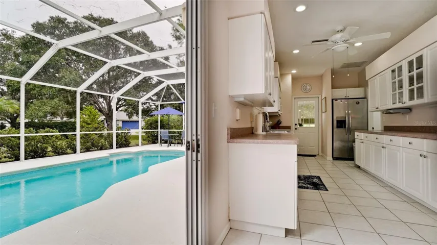 step right out of the kitchen to the pool deck