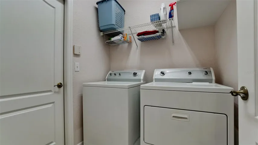 Laundry room off kitchen w/ garage access