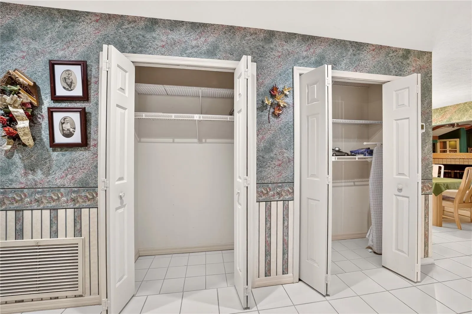 The hallway at the main entrance has 2 closets for storage.