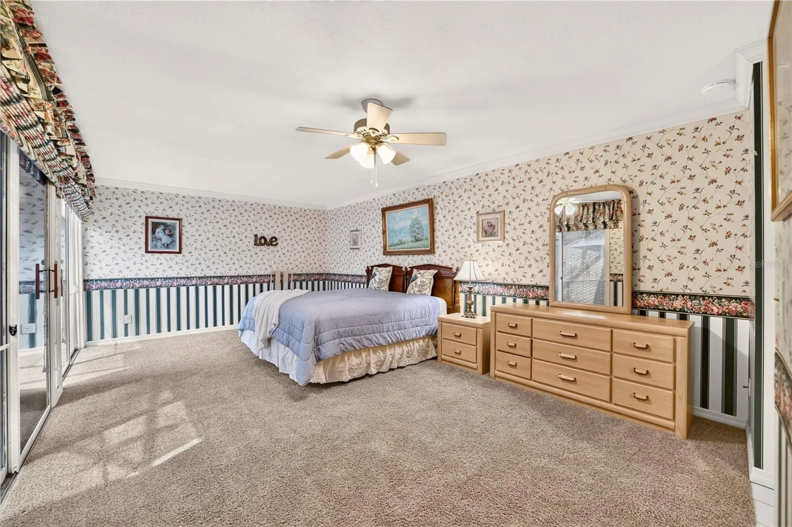 Extra large primary bedroom that easily fits a king size bed with room for office desk or work out equipment if desired.