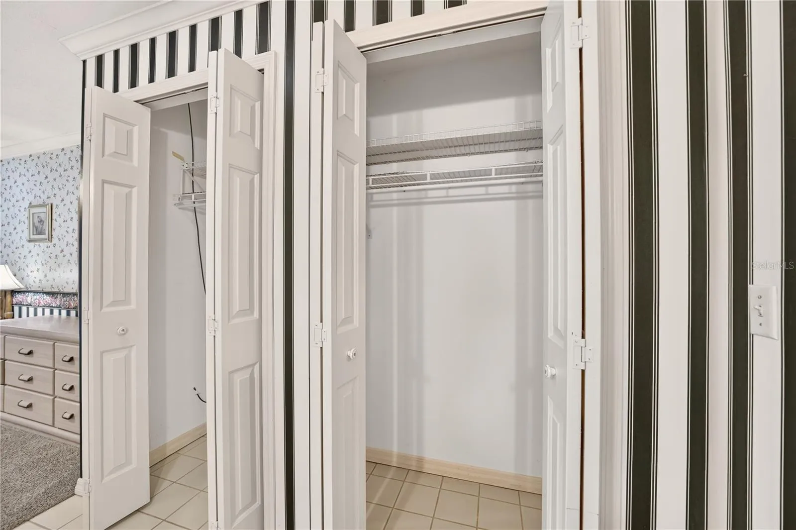 Two closets beside the vanity in the primary bathroom