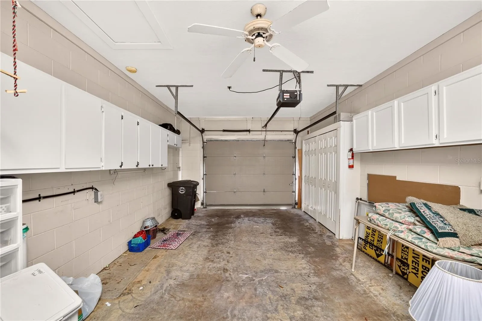 Garage has plenty of storage and holds the washer and dryer