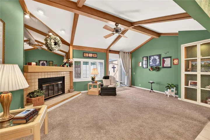 Large living room with vaulted ceiling and fireplace