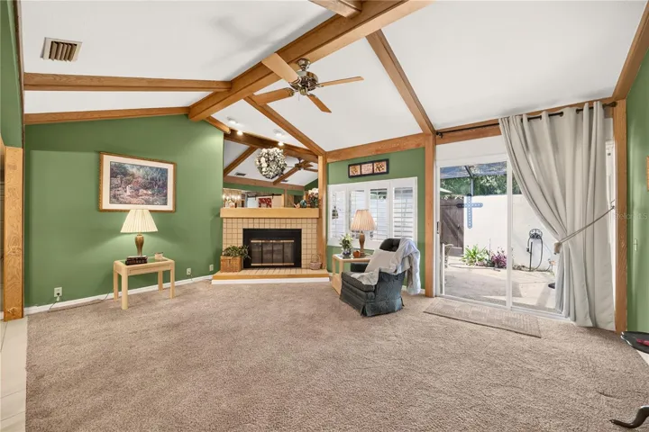 Down the hall you will see the large living room with fireplace
