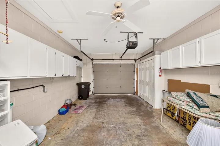 Garage has plenty of storage and holds the washer and dryer