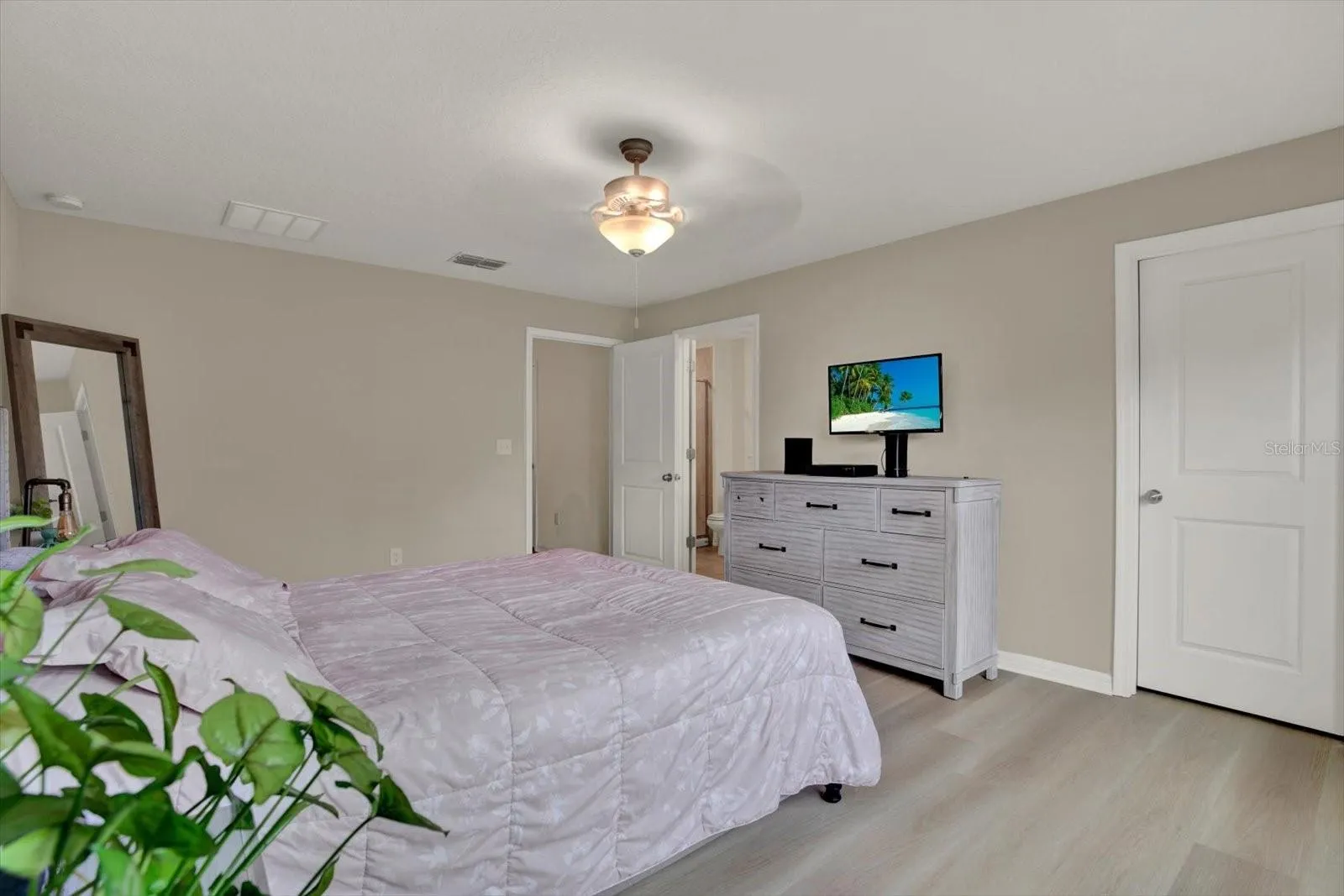 Second Floor Primary bedroom with ceiling fan