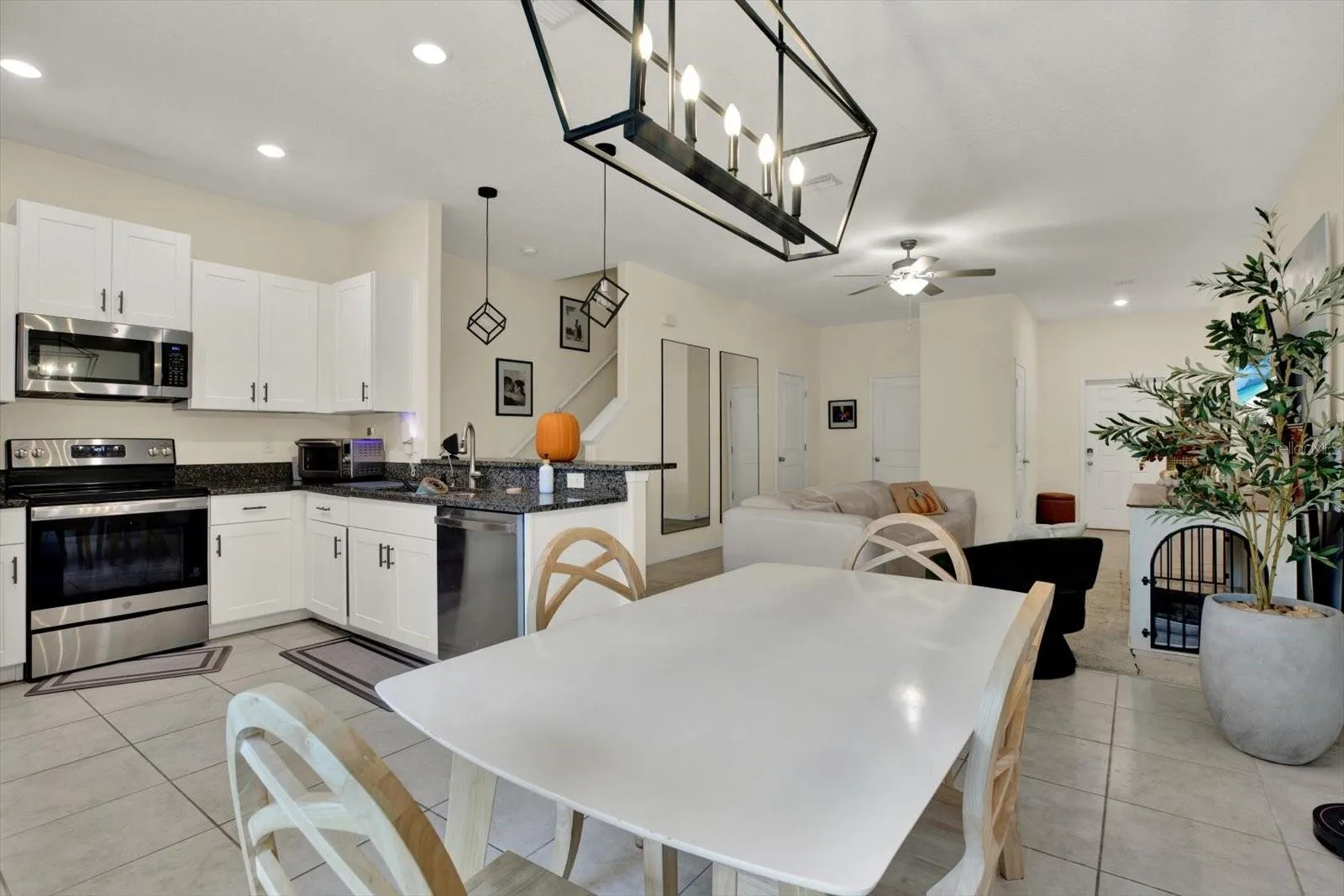 Kitchen, dining, and living areas in one open layout
