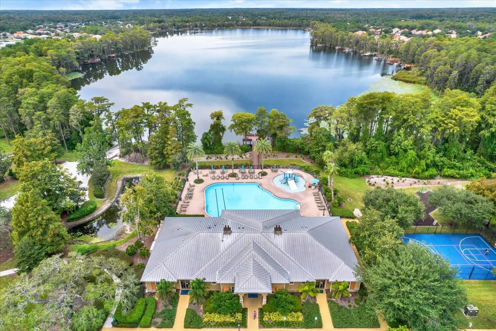 Aerial view of the Waters Ede clubhouse, community pool, and lake