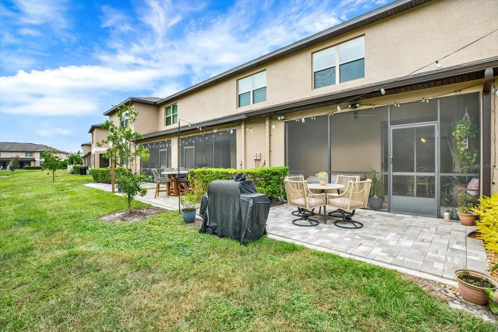 Rear screened lanai and paver patio