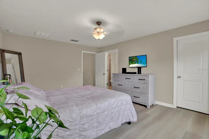 Second Floor Primary bedroom with ceiling fan