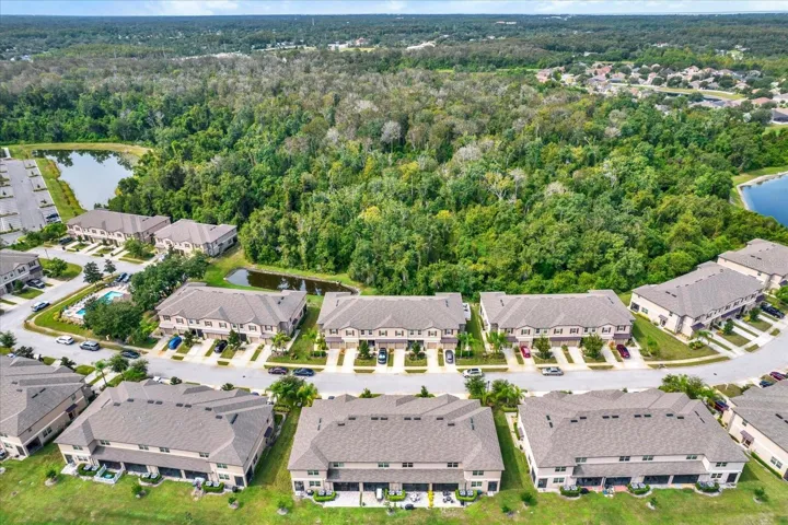Aerial view of the front with garage and driveway