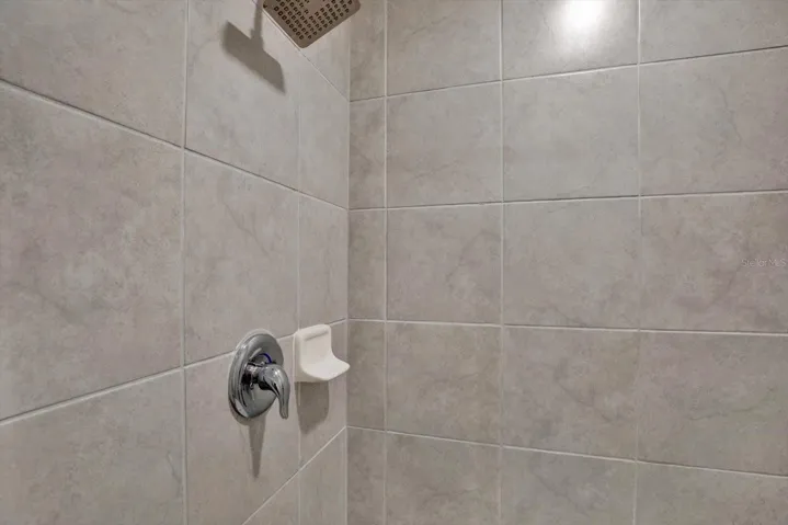 Tiled shower in the primary bath