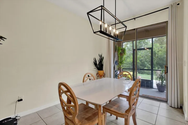 Dining area with sliding doors to the screened lanai