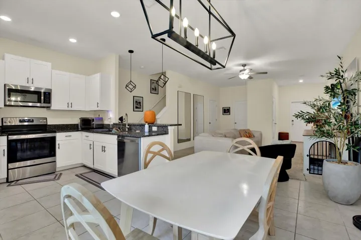 Kitchen, dining, and living areas in one open layout