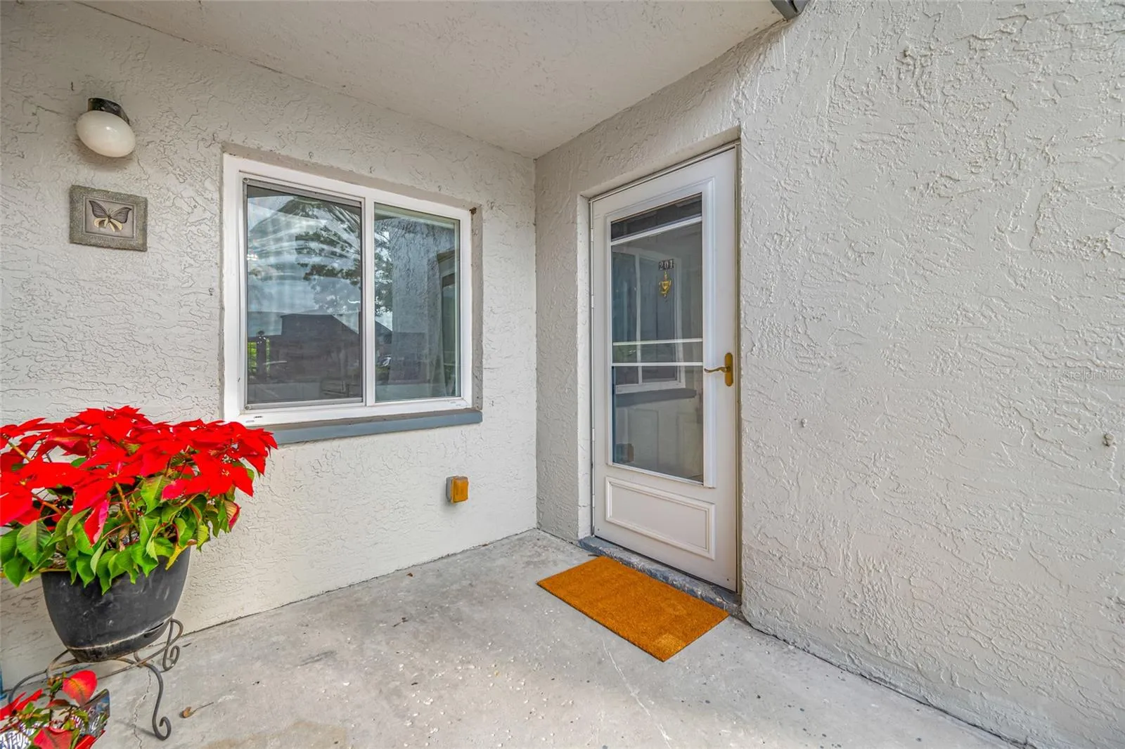 Welcome Home!  Storm door for all-weather enjoyment.
