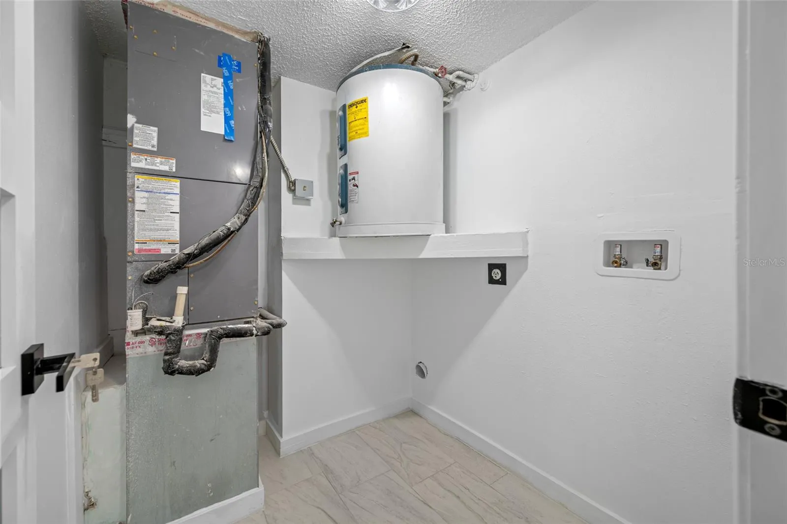 Indoor laundry room.  Space for washer/dryer and more!