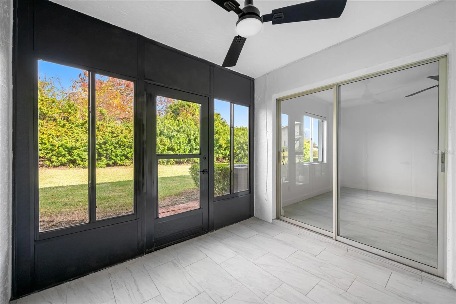Shared lanai with green space view