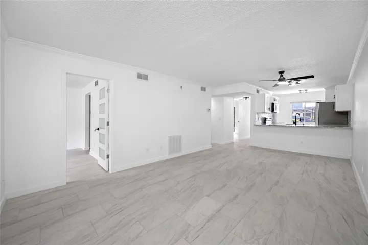 Bright, open living and dining area with views toward the updated kitchen.