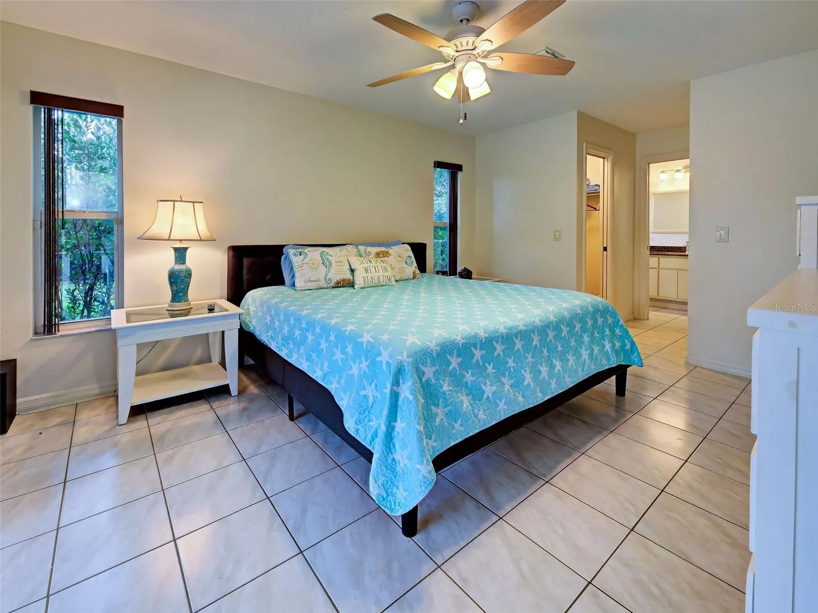 The primary bedroom sanctuary has an ensuite bath and two walk in closets.