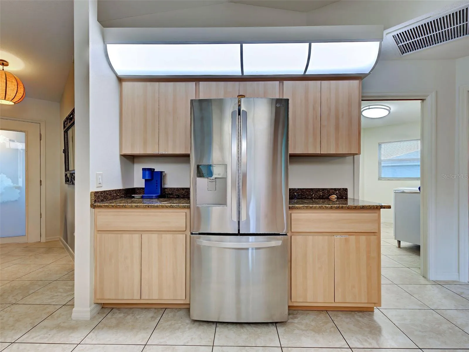 There are ample cabinets and working counter spaces for the chef.