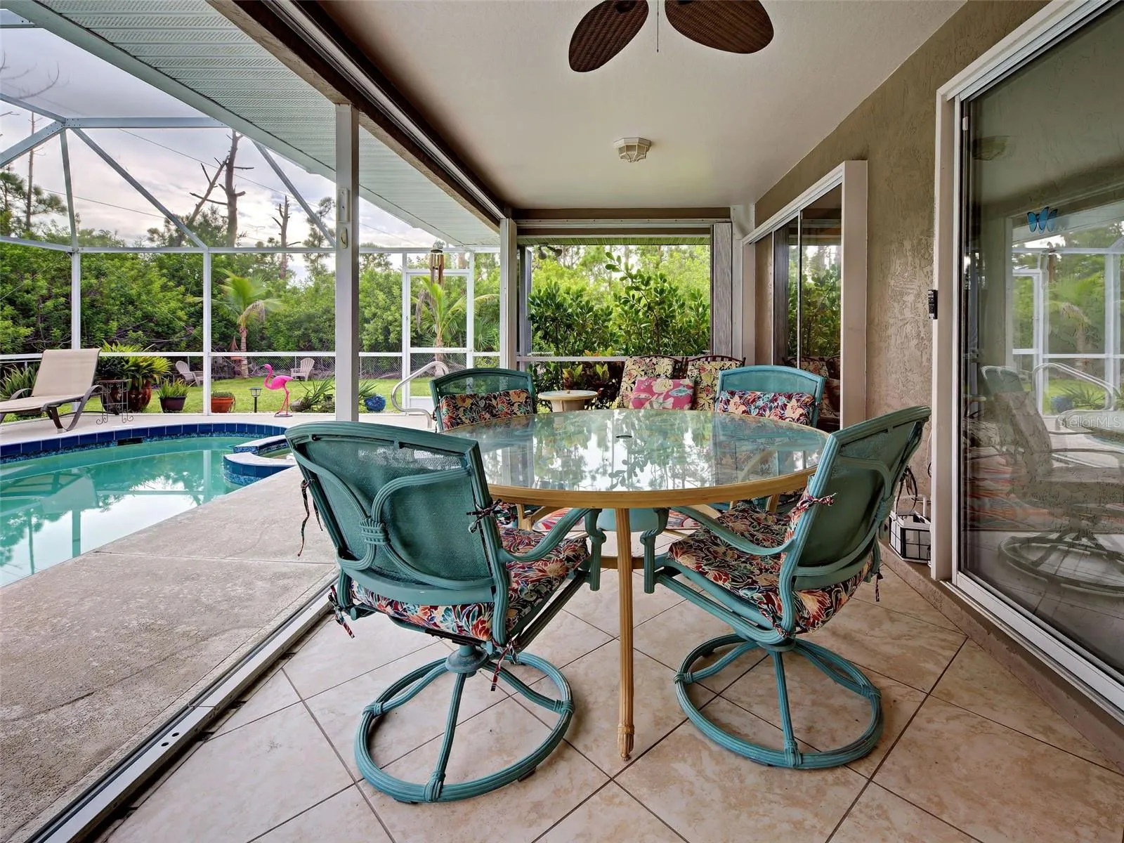 The covered lanai is the perfect spot for an al fresco meal.  Enjoy the outdoors and privacy created by the landscaping.