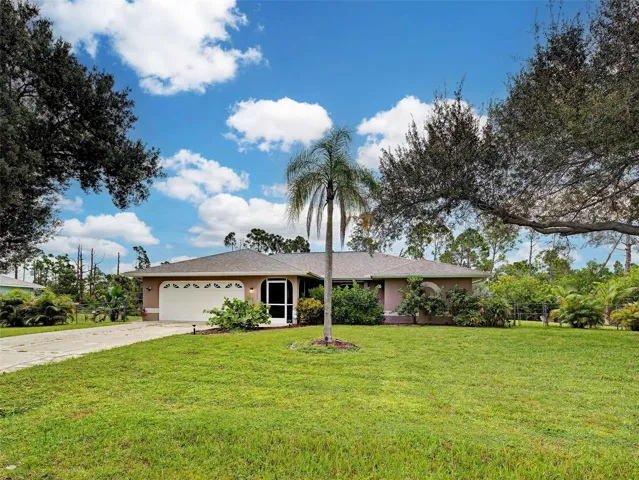 Attractive Florida-style home with mature landscaping.  Great curb appeal.