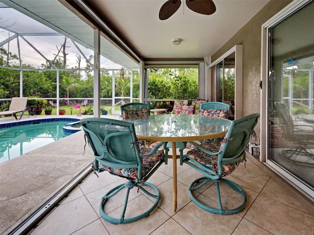 The covered lanai is the perfect spot for an al fresco meal.  Enjoy the outdoors and privacy created by the landscaping.