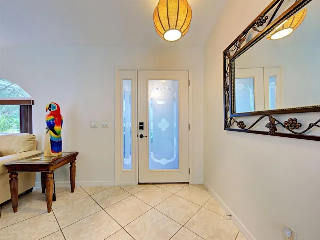 The front door from the inside and the diagonally laid tile floor.