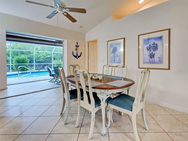 There are pocket sliding glass doors from the dining room to the screened in lanai.  The mature landscaping provides privacy.
