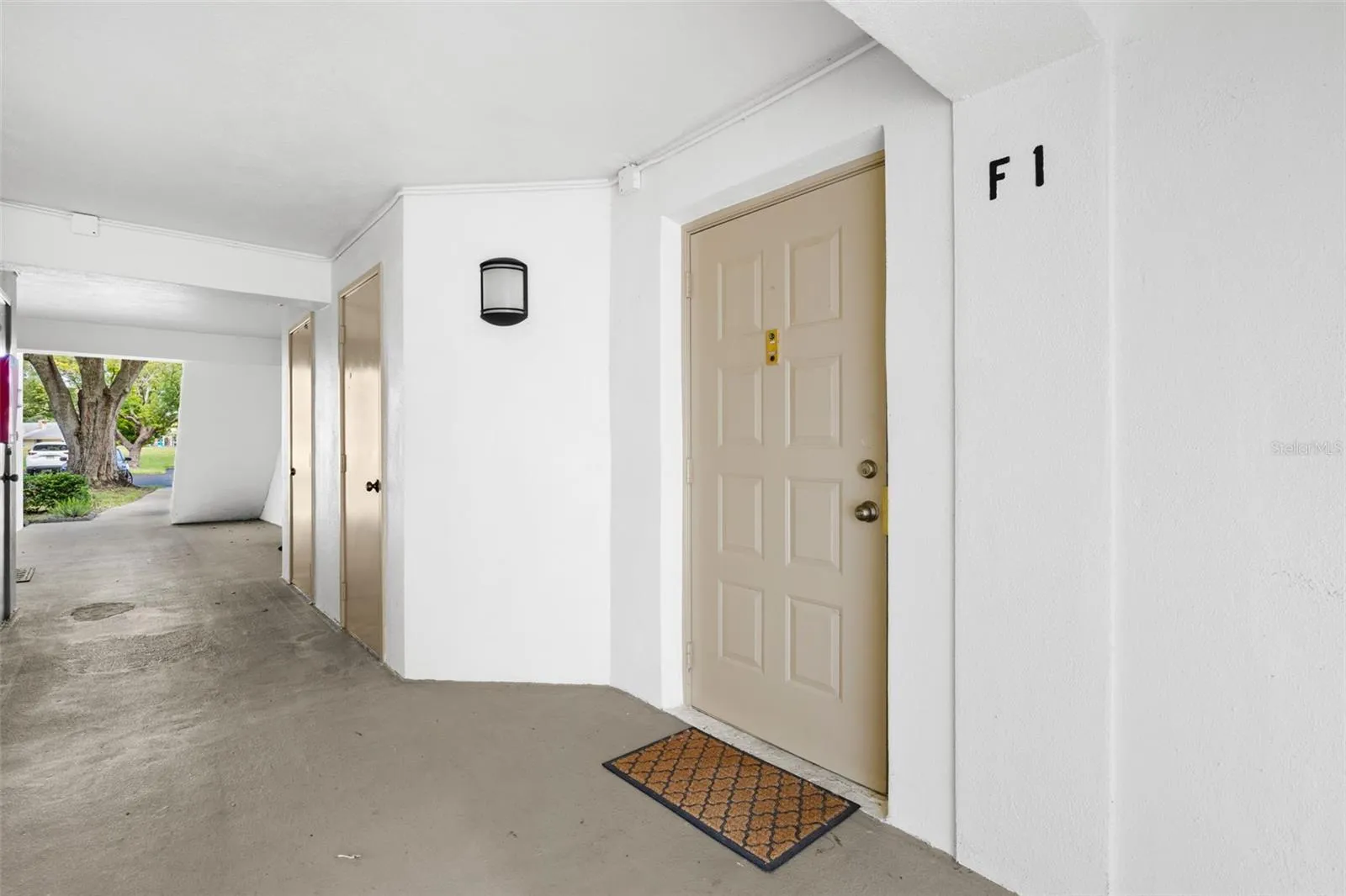 Unit F1 offers convenient first-floor living with a covered entry and no stairs to navigate.