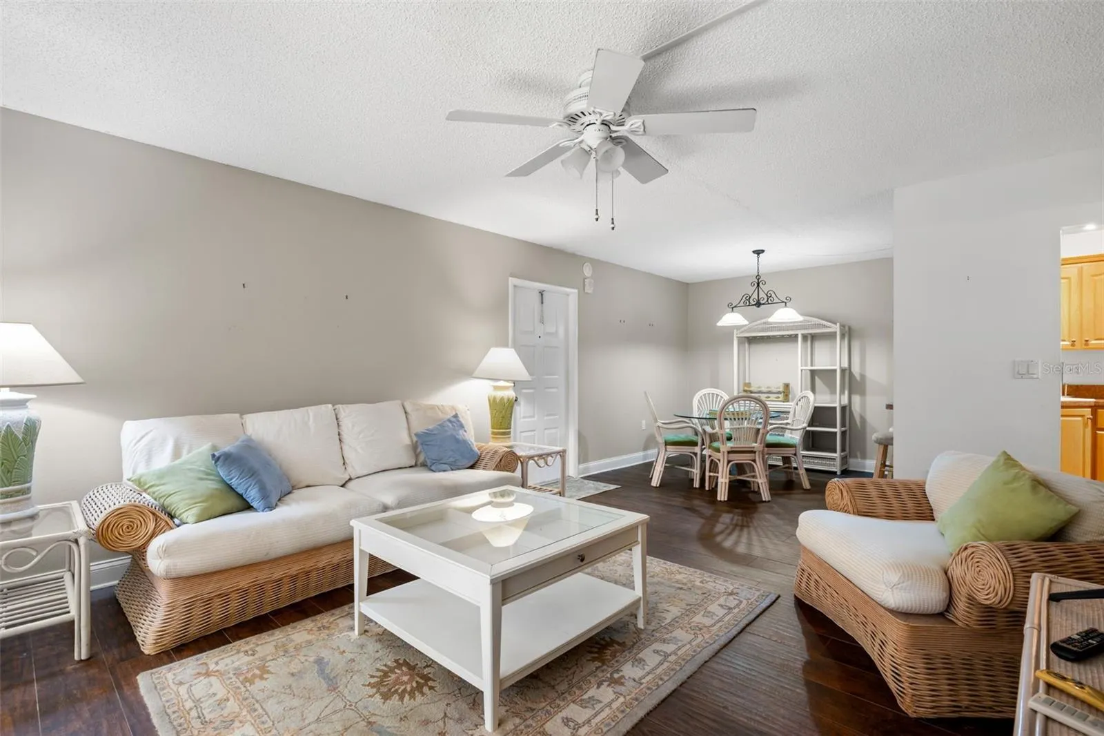 The 13'7" x 15'4" living room offers plenty of space for comfortable seating, while the adjoining dining area creates a natural spot for everyday meals or entertaining.