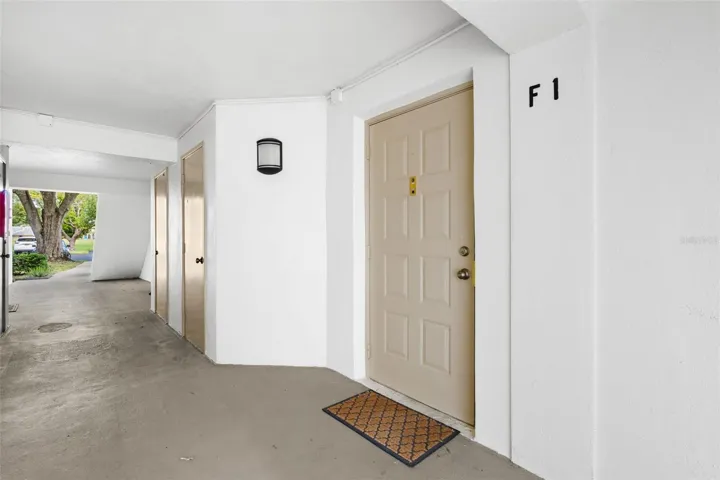 Unit F1 offers convenient first-floor living with a covered entry and no stairs to navigate.