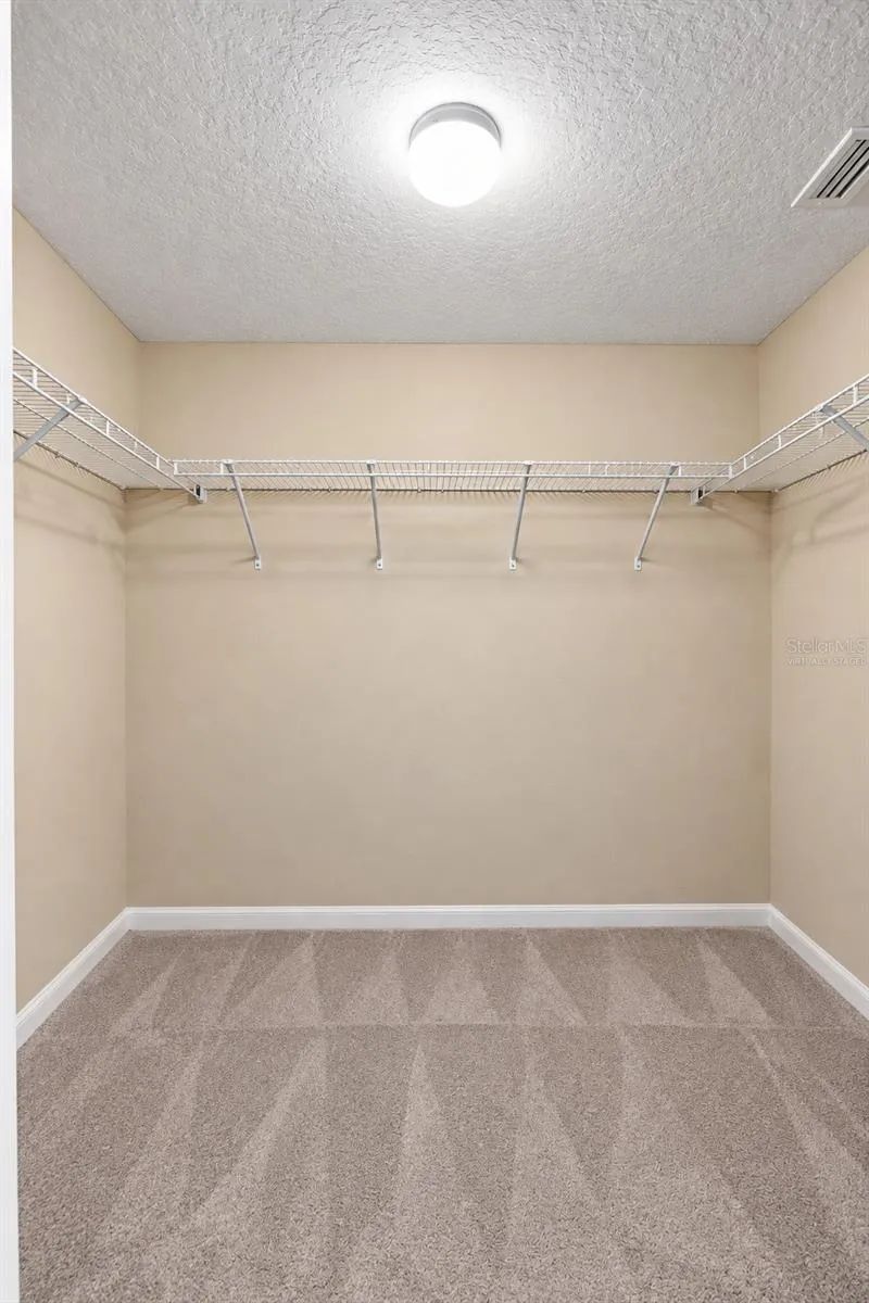 MASTER CLOSET- 1 OF 2- VIRTUALLY STAGED