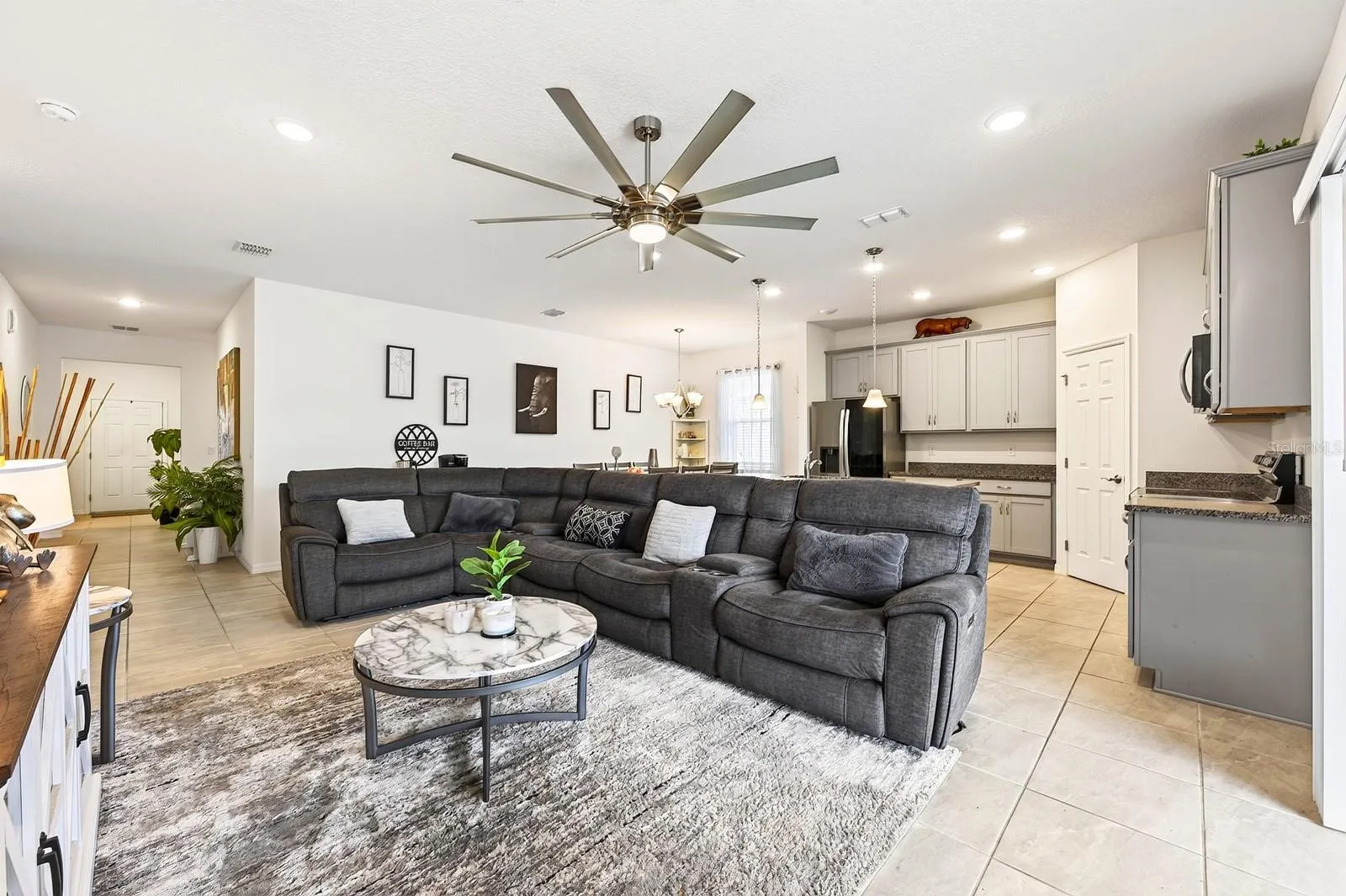 Inside, the OPEN FLOOR PLAN allows the Living Room, Dining Area and Kitchen to flow seamlessly together, creating a bright and inviting space for everyday living and entertaining.
