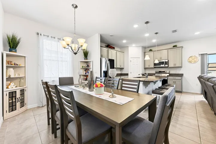 TILE FLOORING throughout the main living areas and NO CARPET make the home easy to maintain.