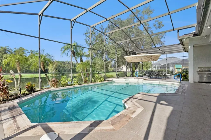 Oversized pool/spa area with screen enclosure - View 3.