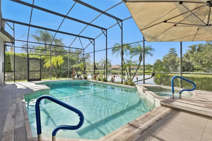 Oversized pool/spa area with screen enclosure - View 2.