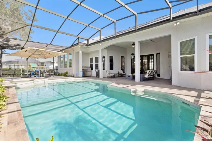 Oversized pool/spa area with screen enclosure.