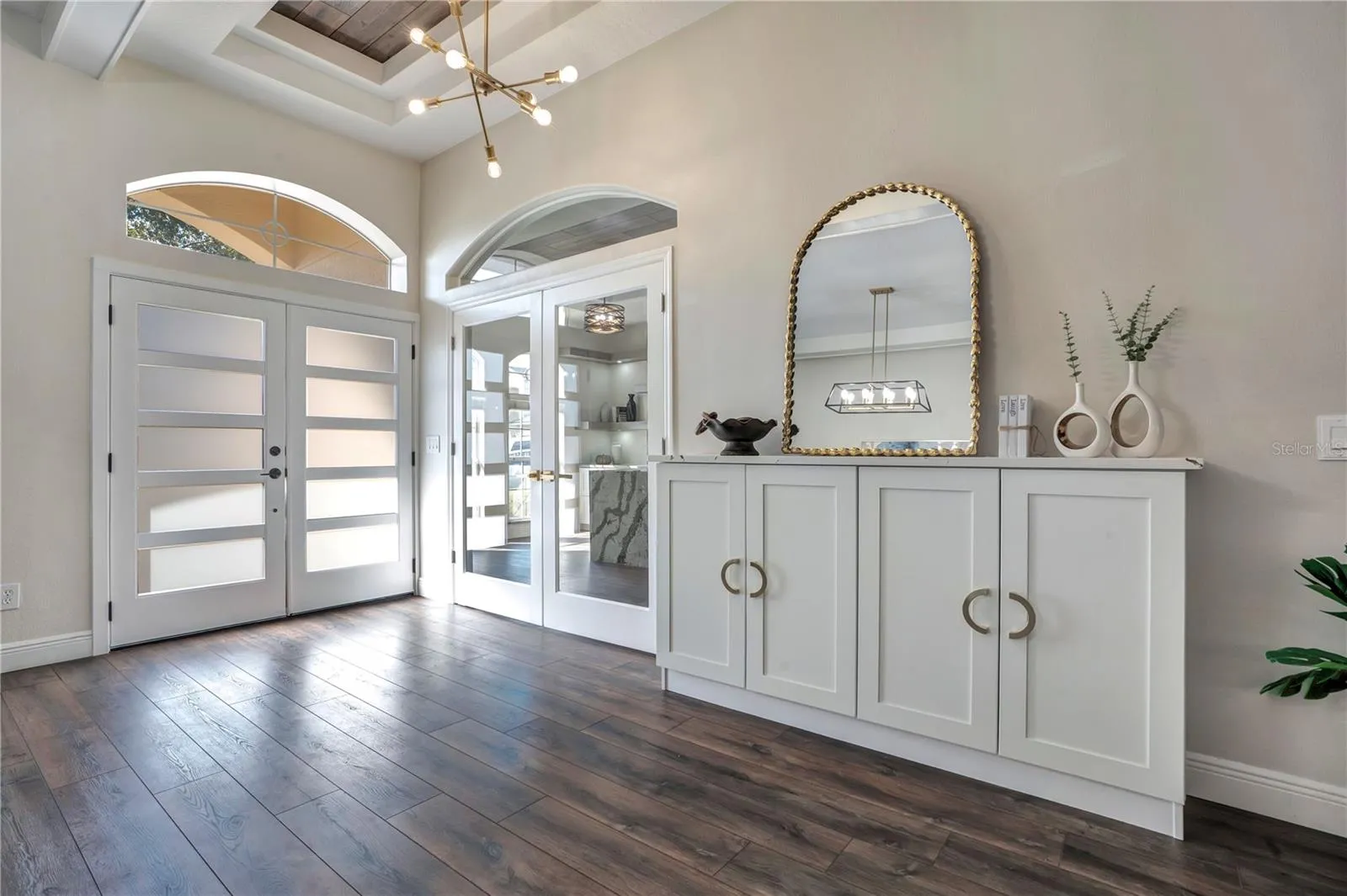 Frosted-glass double entry doors and built-in console.