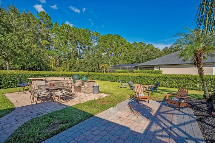 Paver patios and fire pit in a private yard.