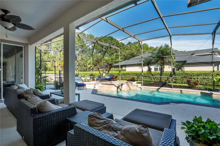 Covered lanai overlooking the screened pool.