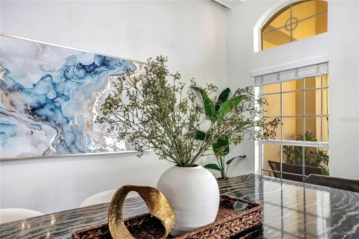 Natural light pours through arched transom windows.