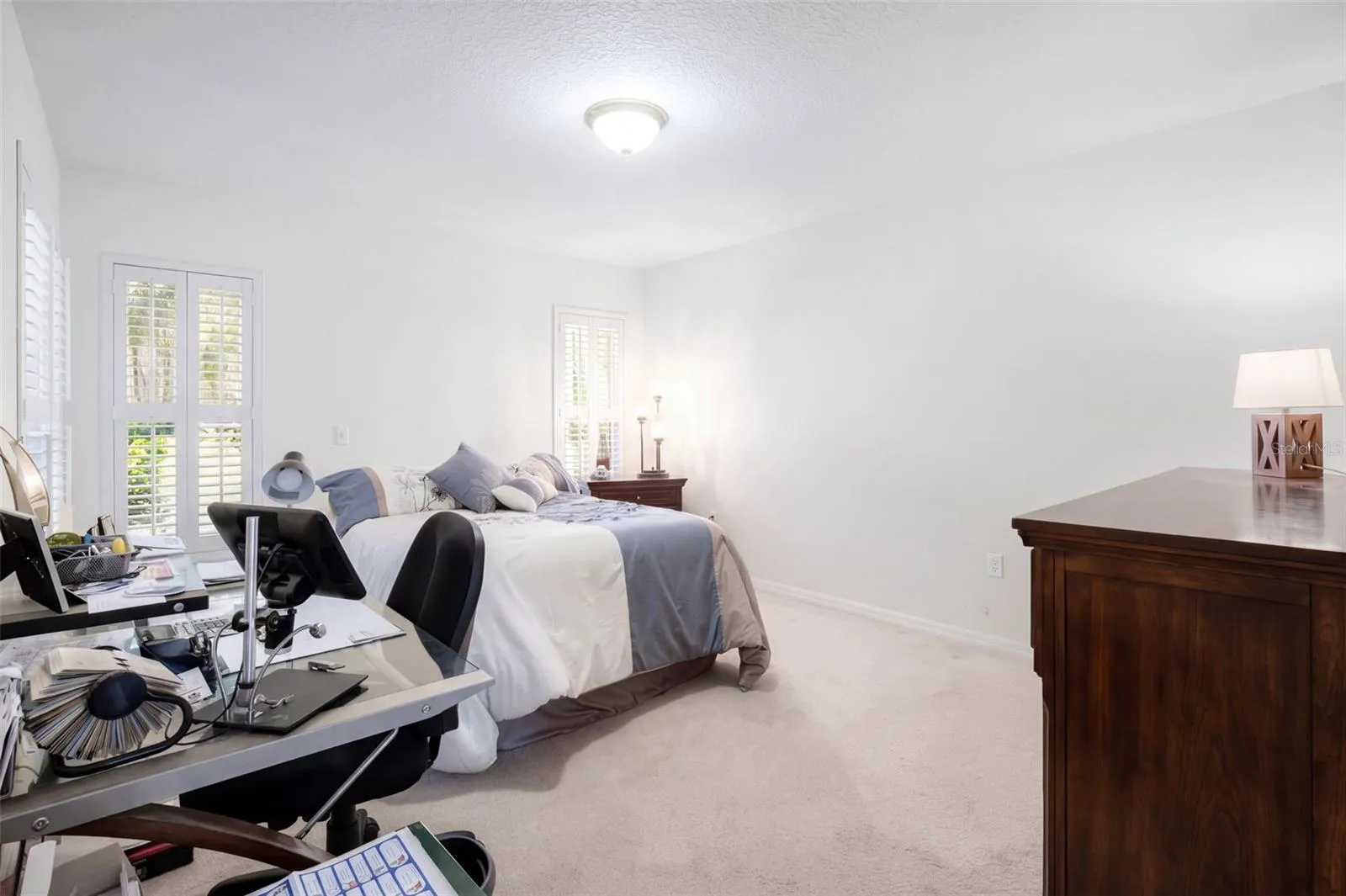 An additional view of the second bedroom shows its proportions and closet access.